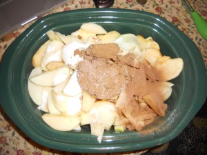 Combine the brown and white sugar and the spices  with the apples in the slowcooker