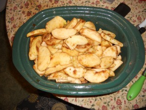 Use your hands and combine the sugars and spices with the apples. 